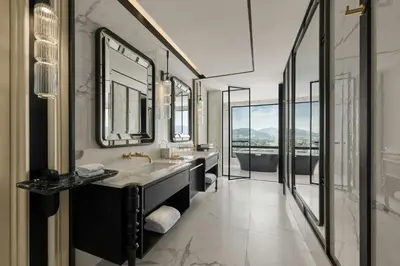 a bathroom with two sinks and a large mirror at The Millen Penang, Autograph Collection in George Town