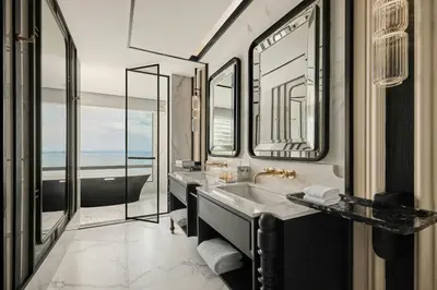 a bathroom with a sink and a bath tub at The Millen Penang, Autograph Collection in George Town