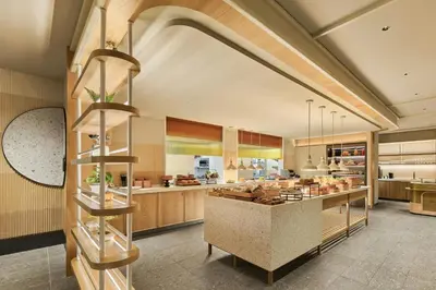 a large kitchen with a counter in the middle at The Millen Penang, Autograph Collection in George Town