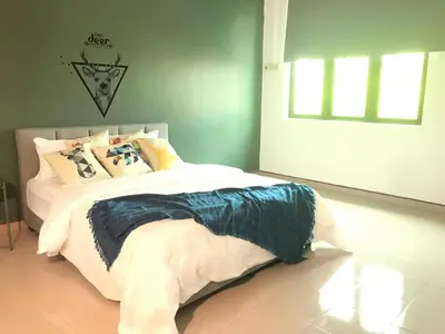 a bedroom with a bed in a room at The Alley's @ Sitiawan, Manjung in Sitiawan