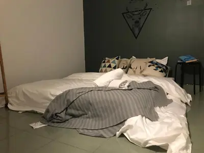 two beds sitting next to each other in a bedroom at The Alley's @ Sitiawan, Manjung in Sitiawan