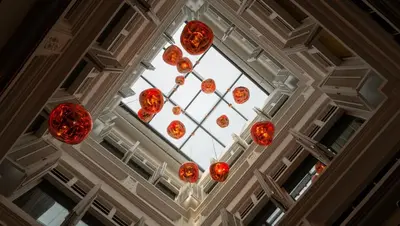 a ceiling with red lights in a building at 88 Armenian in George Town