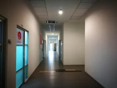 an empty hallway of an office building with a long corridor at Comfort Zone @ The CEO Loft by Joal in George Town
