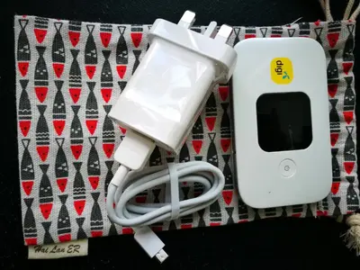 a white ipod plugged into an electronic device at Comfort Zone @ The CEO Loft by Joal in George Town