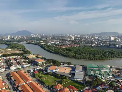 an aerial view of a city with a river at Mevin Woodsbury Butterworth Homestay in Butterworth