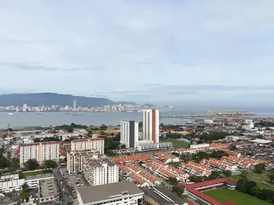 an aerial view of a city with buildings and the water at Mevin Woodsbury Butterworth Homestay in Butterworth