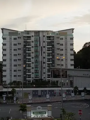 a large apartment building in front of a parking lot at ICOLOR HOME & STAY CH2 in Tanah Rata
