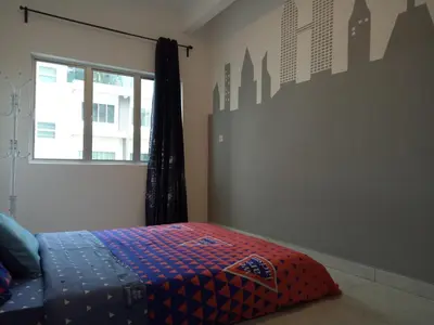 a bedroom with a bed and a window in it at ICOLOR HOME & STAY CH3 in Tanah Rata