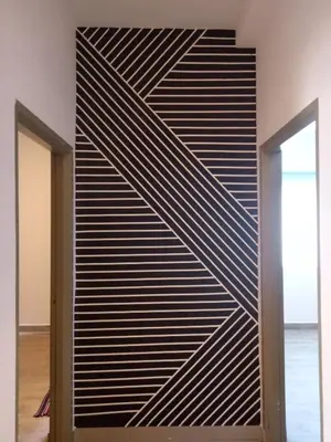 a wall with black and white stripes at ICOLOR HOME & STAY CH5 in Tanah Rata