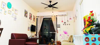 a living room with a ceiling fan and a couch at Mevin Woodsbury Suite Butterworth Penang in Butterworth