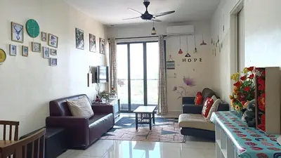 a living room with a couch and chairs and a tv at Mevin Woodsbury Suite Butterworth Penang in Butterworth