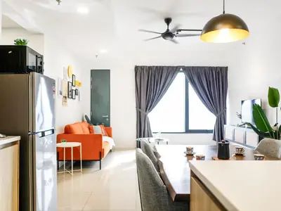 a kitchen and a living room with a couch at Casita 22, 218 Macalister Georgetown City & Seaview in George Town