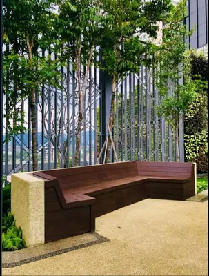 a wooden bench sitting in front of a fence at Casita 22, 218 Macalister Georgetown City & Seaview in George Town