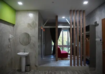 a bathroom with a sink and a mirror at Rick Resort Teluk Intan in Teluk Intan
