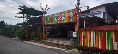 a fast food restaurant with a colorful building at Rick Resort Teluk Intan in Teluk Intan