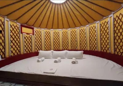 a room with a bed with two elephants on it at Rick Resort Teluk Intan in Teluk Intan