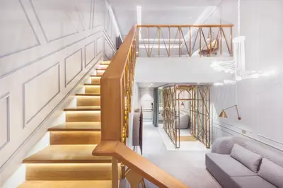 a staircase in a house with wood and white walls at The Prestige Hotel Penang, a Member of Design Hotels in George Town