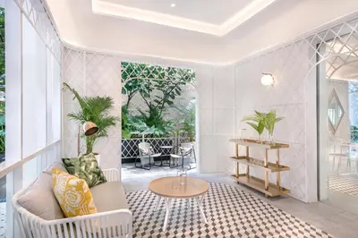 a living room with a couch and a table at The Prestige Hotel Penang, a Member of Design Hotels in George Town
