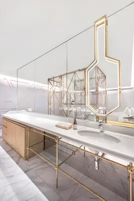 a bathroom with a large mirror and a sink at The Prestige Hotel Penang, a Member of Design Hotels in George Town