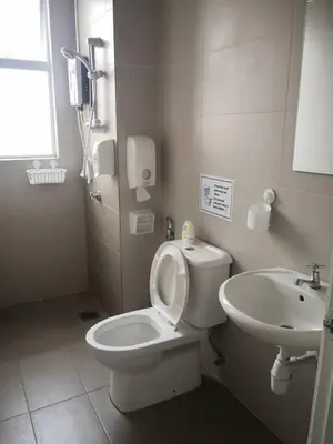 a bathroom with a toilet and a sink at My Homestay S1311 - Golden Hills Night Market in Cameron Highlands