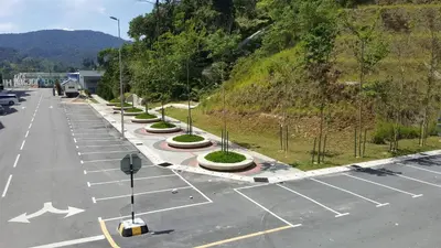 a parking lot with a row of street lights at My Homestay S1311 - Golden Hills Night Market in Cameron Highlands