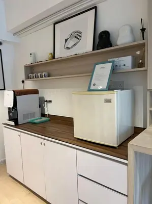 a kitchen with a counter with a machine on it at Minima 8 in George Town