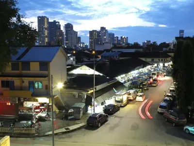 a city street with cars parked in a parking lot at Minima 8 in George Town