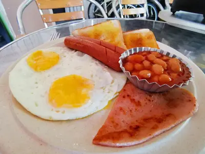 a plate of breakfast food with eggs and toast at 8 Boutique By The Sea in George Town