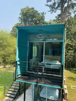 a blue rv with a bed in the middle at Sarang by the brook in Kuala Kubu Baharu