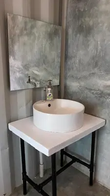 a white sink on a counter in a bathroom at Sarang by the brook in Kuala Kubu Baharu