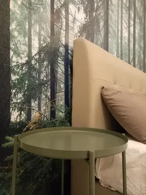a coffee table next to a couch in the woods at NATURE @ FOREST CAMERON 15 in Tanah Rata