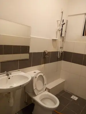 a bathroom with a toilet and a sink at NATURE @ FOREST CAMERON 15 in Tanah Rata