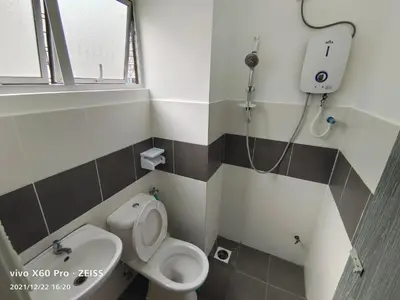 a small bathroom with a toilet and a sink at SKY PURPLE @CH in Tanah Rata