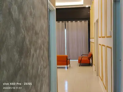 a hallway with orange chairs in a room at CLASSIC ENGLISH @ CH in Tanah Rata