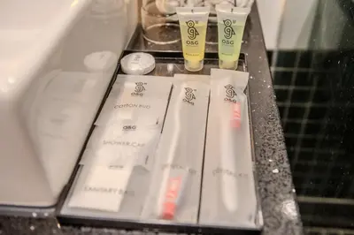 a group of white toothbrushes sitting on a counter at O&G Hotel Parit Buntar in Parit Buntar