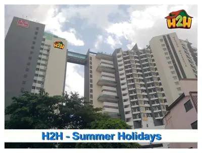 two tall buildings with a mitzi sign on them at H2H - Summer Holidays Majestic Ipoh in Ipoh