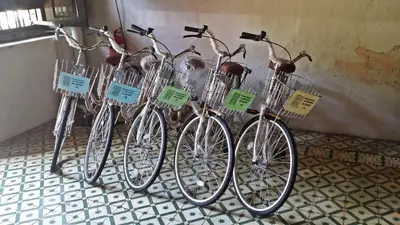 a group of bikes are lined up against a wall at Muntri House by Virtue Hospitality in George Town