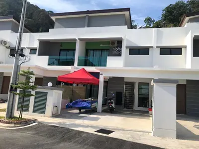 a white house with a red tent in front of it at 2sty Villa - Walking Distance To The Beach in Pangkor