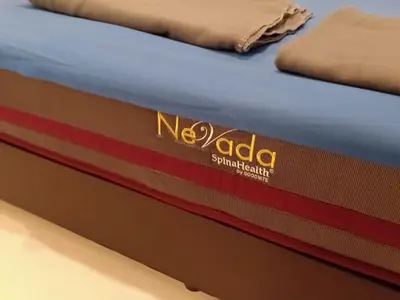 a mattress with the noda logo on it at 2sty Villa - Walking Distance To The Beach in Pangkor