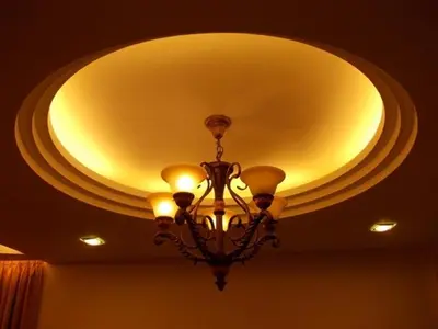 a chandelier hanging from a ceiling in a room at Bali Style Apartment @ Imperial Court in Cameron Highlands