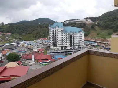 a view of a city from the balcony of a building at Bali Style Apartment @ Imperial Court in Cameron Highlands