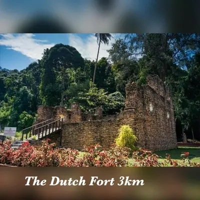 an old brick building with a bunch of flowers at coralbay apartment pangkor island in Pangkor