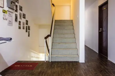 a staircase in a room with a stair case at Nice Inn in George Town