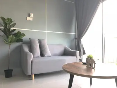 a living room with a couch and a table at DreamScape Studio @ Golden Hill Cameron in Cameron Highlands