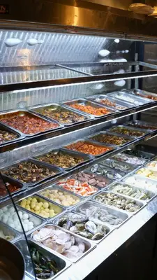 a buffet line with many different types of food at DreamScape Studio @ Golden Hill Cameron in Cameron Highlands