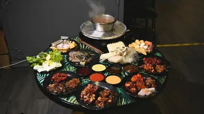 a table with a bunch of different types of food at DreamScape Studio @ Golden Hill Cameron in Cameron Highlands