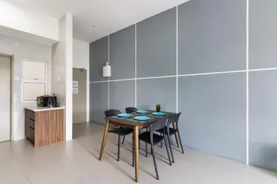 a kitchen and dining room with a table and chairs at DreamScape Studio @ Golden Hill Cameron in Cameron Highlands