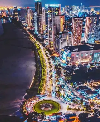 a city at night with a lot of traffic at Susie's VIP Resort Seaview Suite at Sri Sayang in Batu Ferringhi