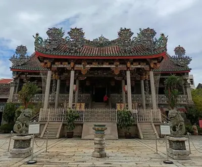a large building with a building with a roof at Susie's VIP Resort Seaview Suite at Sri Sayang in Batu Ferringhi