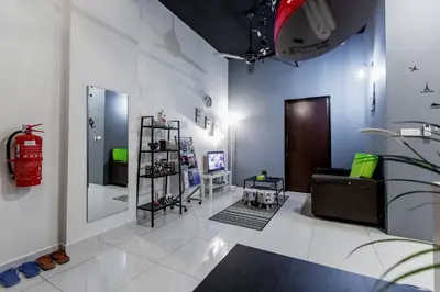 a living room with a fire hydrant on the wall at Cozy Home with Spectacular View in Bayan Lepas